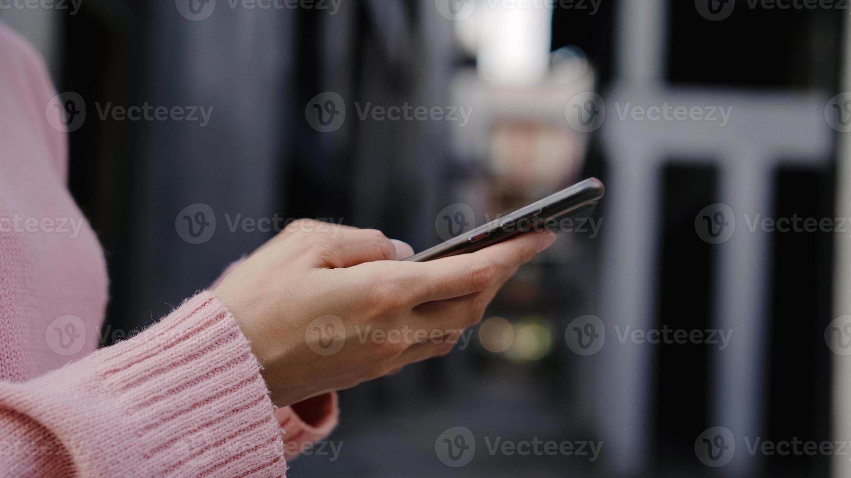 Cheerful Asian backpacker blogger woman using smartphone for direction and looking on location map while traveling at Chinatown in Beijing, China. Lifestyle backpack tourist travel holiday concept. photo