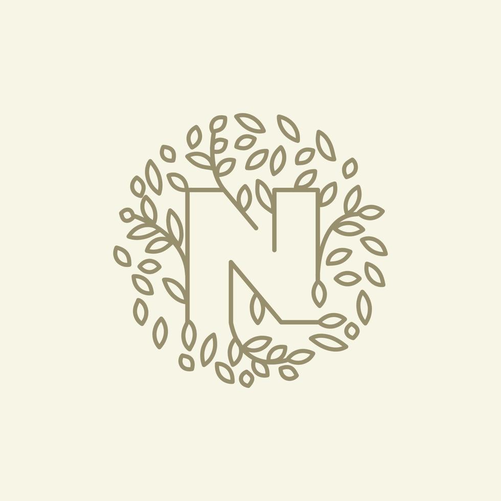initial N or letter N with leaf  ornament on circle luxury modern logo vector icon illustration design