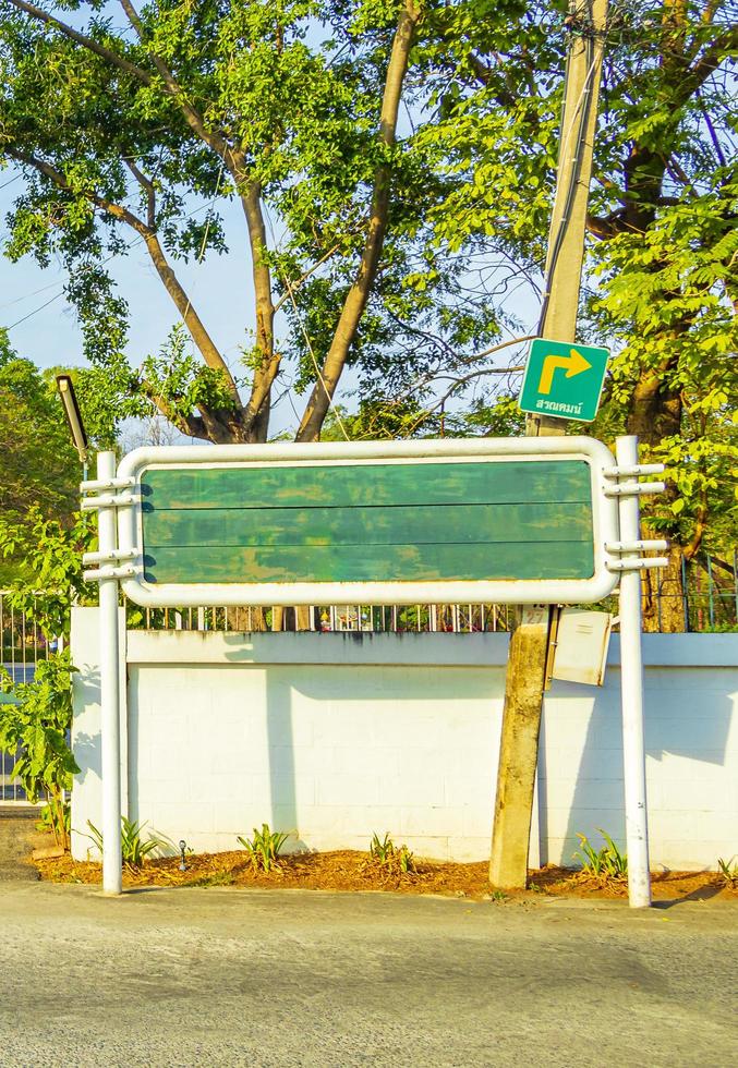 Green entrance gate and sign natural park in Bangkok Thailand. photo