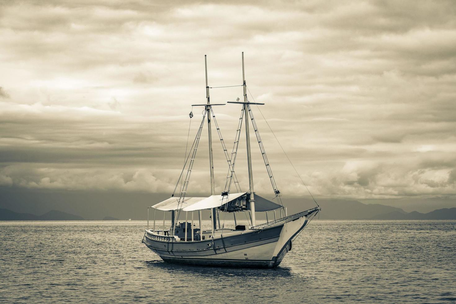 Ship sailing boats Praia de Palmas beach Ilha Grande Brazil. photo