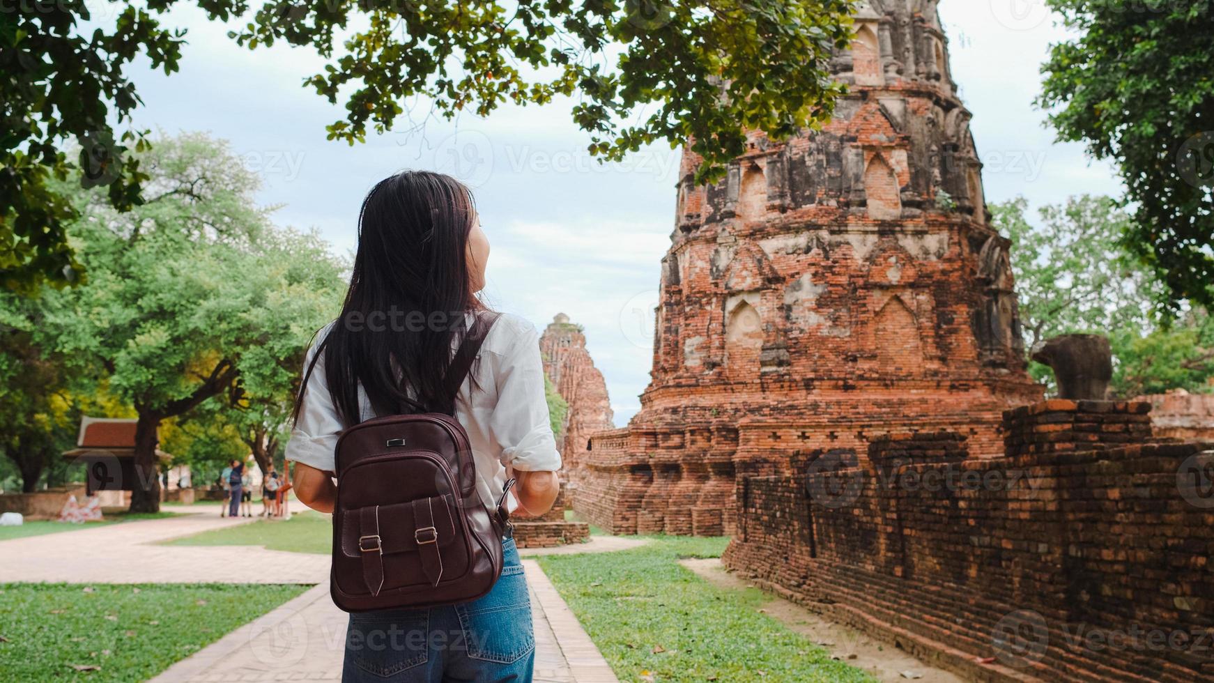 Traveler Asian woman spending holiday trip at Ayutthaya, Thailand, Japanese backpacker female enjoy her journey at amazing landmark in traditional city. Lifestyle women travel holidays concept. photo