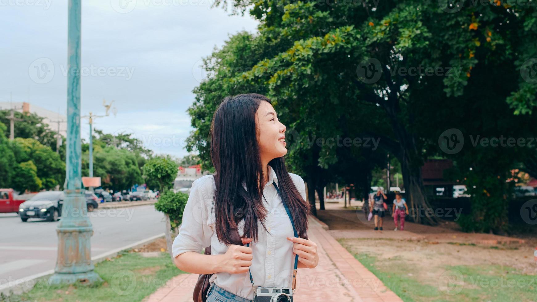 Traveler Asian woman spending holiday trip at Ayutthaya, Thailand, Japanese backpacker female enjoy her journey at amazing landmark in traditional city. Lifestyle women travel holidays concept. photo