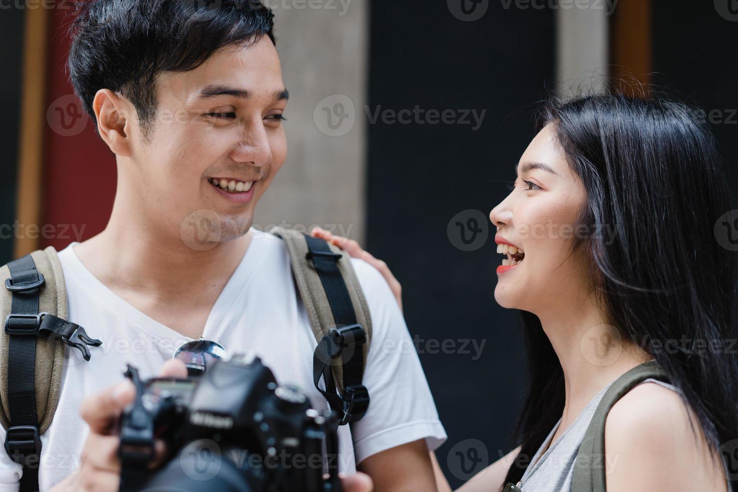 Traveler Asian couple using camera for take a picture while spending holiday trip at Beijing, China, couple enjoy journey at amazing landmark in city. Lifestyle couple travel in city concept. photo