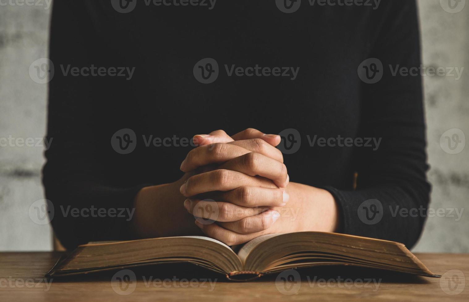 Woman prayer on bible, worship and religion. concept for faith, old Bible. copy space photo