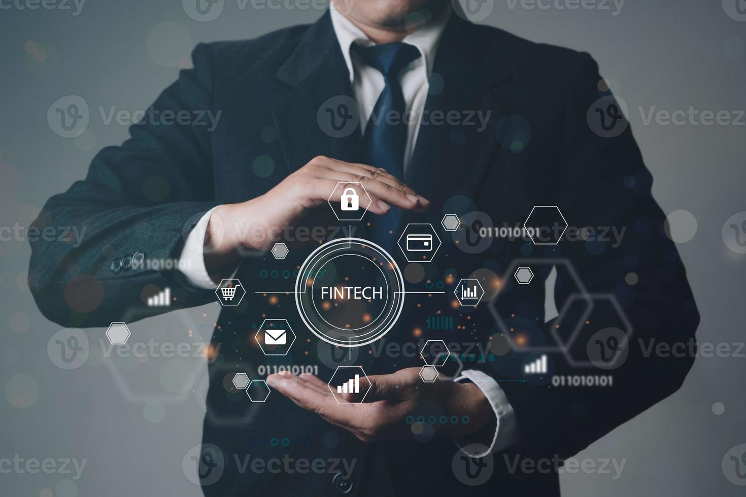Close up of businessman hand holding to Fintech Financial technology Cryptocurrency investment and digital money. Business concept on virtual screen. photo