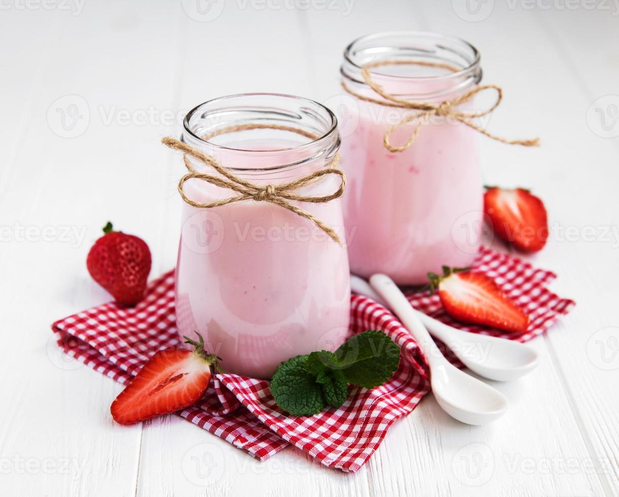 Jars with strawberry yogurt photo