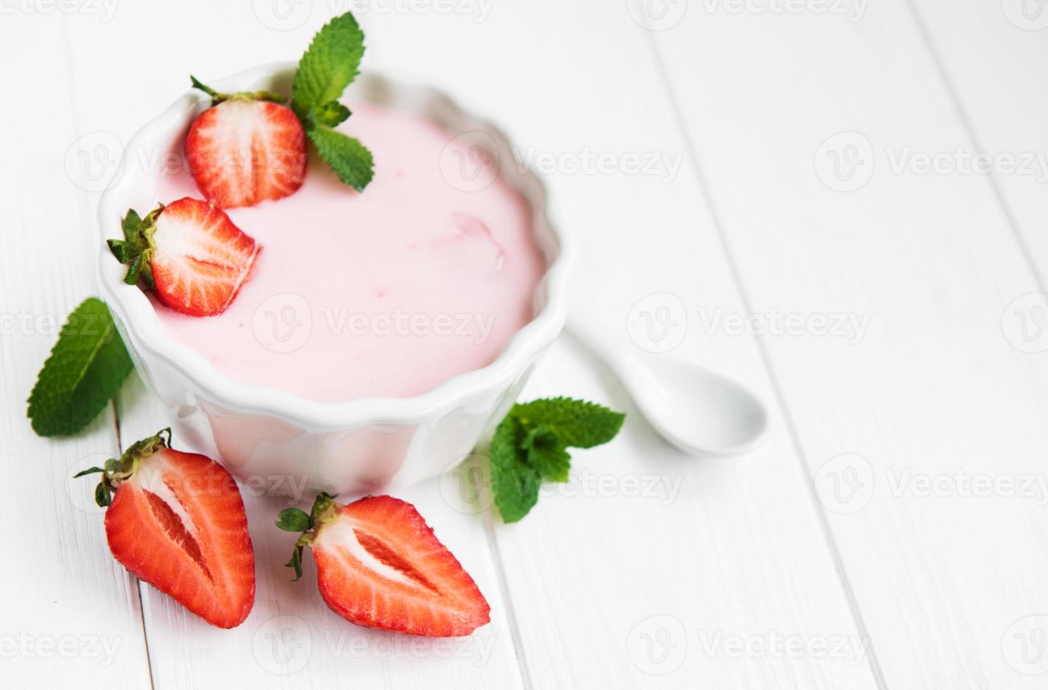 Bowl with strawberry yogurt photo