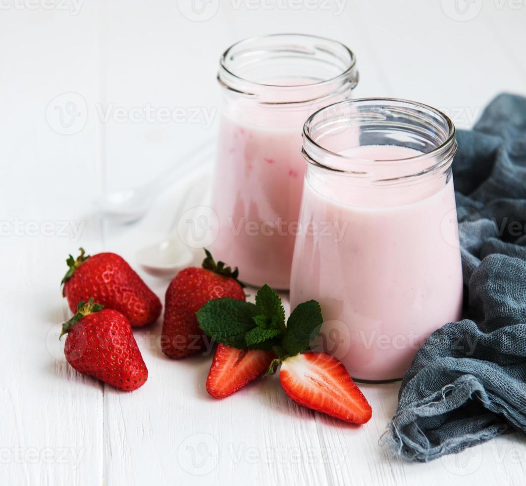 Jars with strawberry yogurt photo