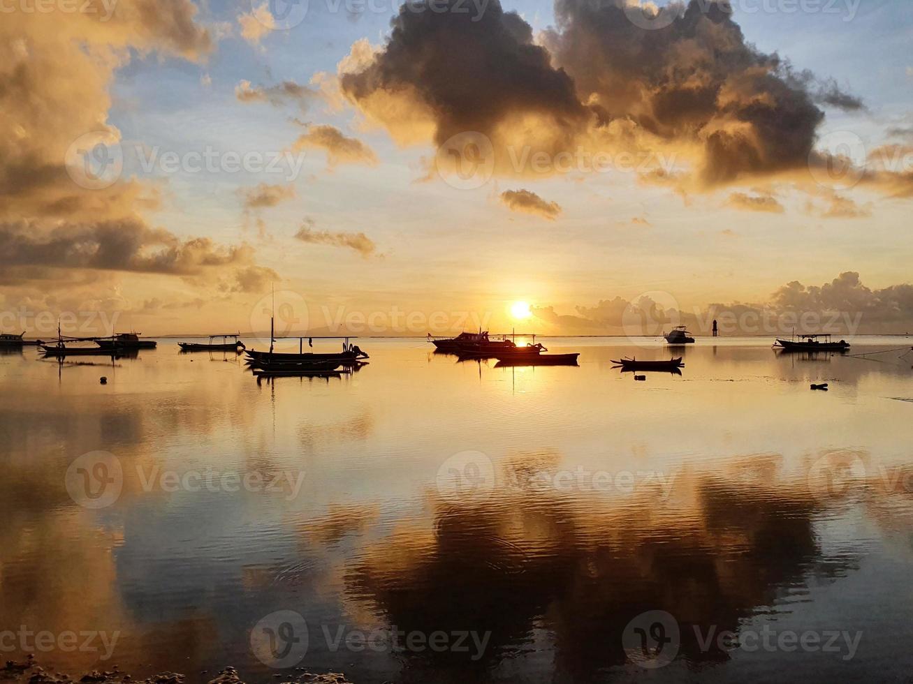 Beautiful morning sun on the beach in Sanur Bali, Indonesia photo