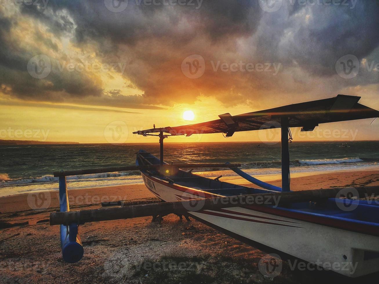 Beautiful morning sun on the beach in Sanur Bali, Indonesia photo