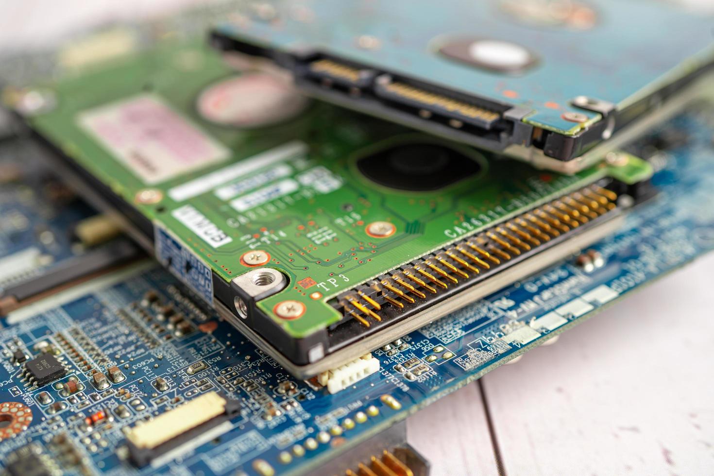 Technician repairing inside of mobile phone by soldering iron. Integrated Circuit. the concept of data, hardware, technology. photo