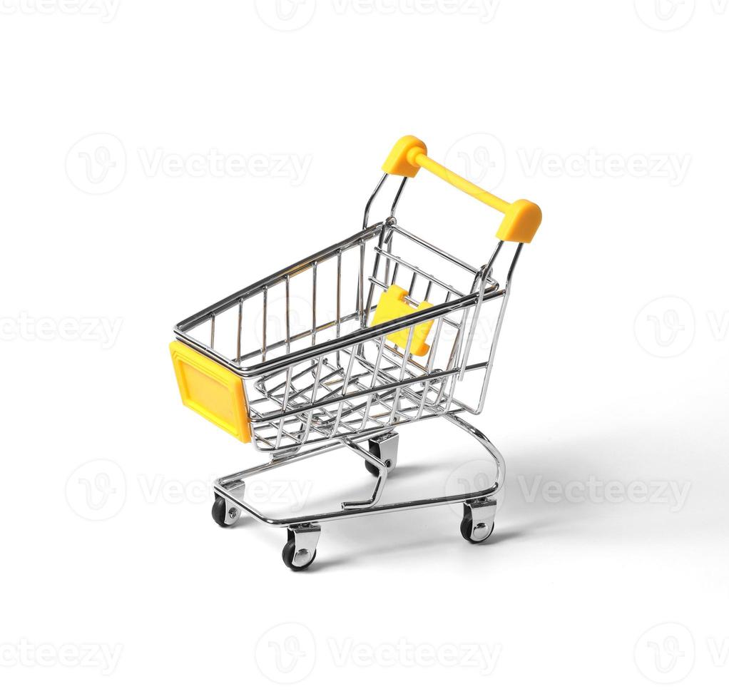 empty shopping trolley isolated on white background. close-up of shopping cart on white background with some copy space. photo