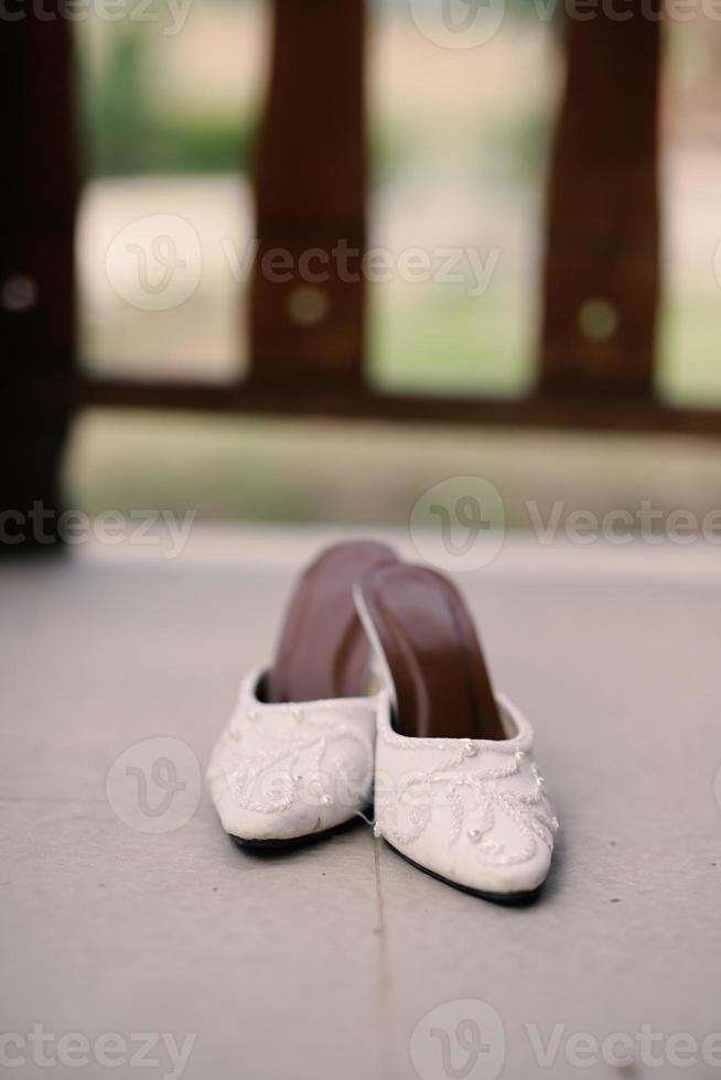 Elegant white wedding shoes photo