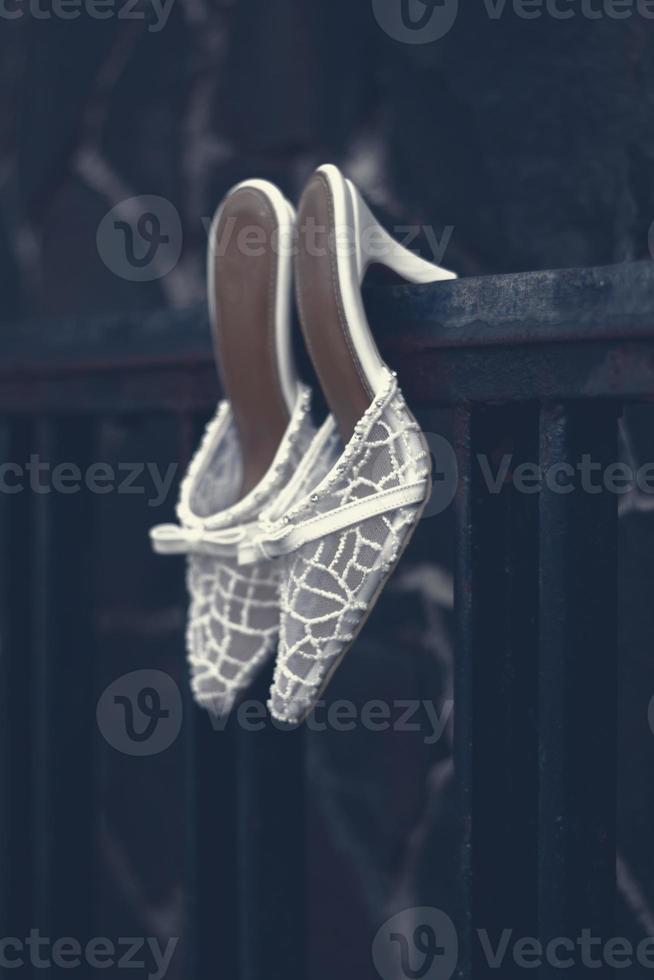 Elegant white wedding shoes photo