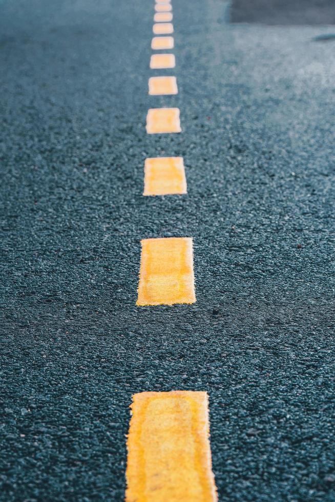 Asphalt Road Texture With Yellow Strip photo