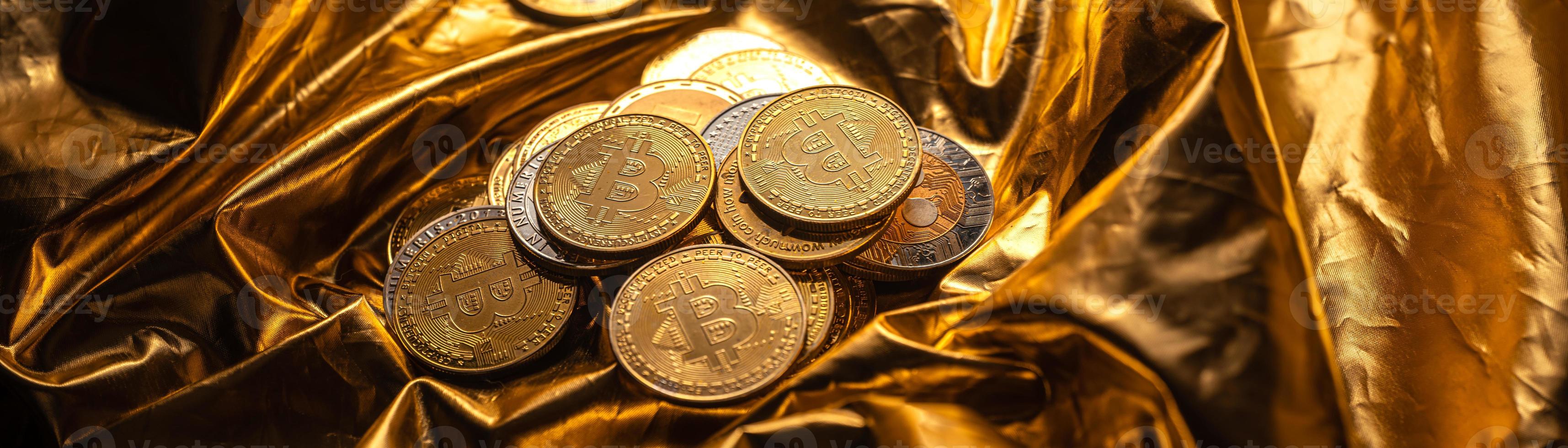 Cryptocurrency  coin and bitcoin on golden background photo