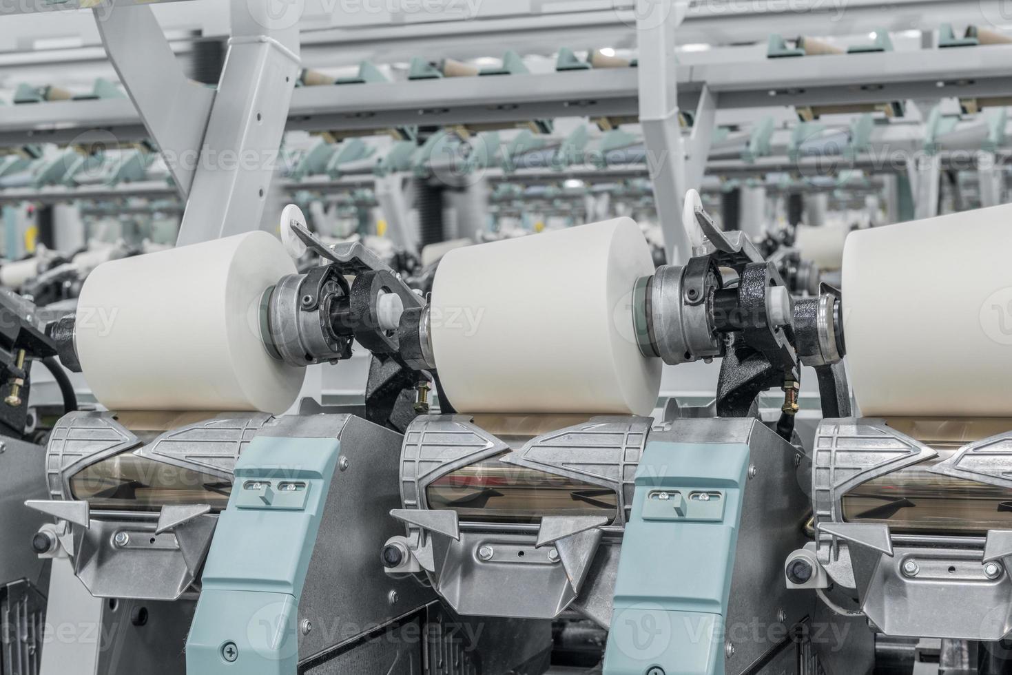 Machinery and equipment in the workshop for the production of thread. Industrial textile factory photo