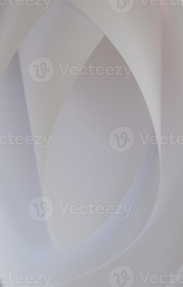 abstract background of a twisted sheet of white paper photo