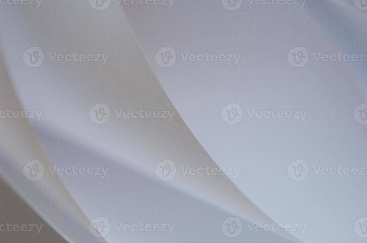 abstract background of a twisted sheet of white paper photo