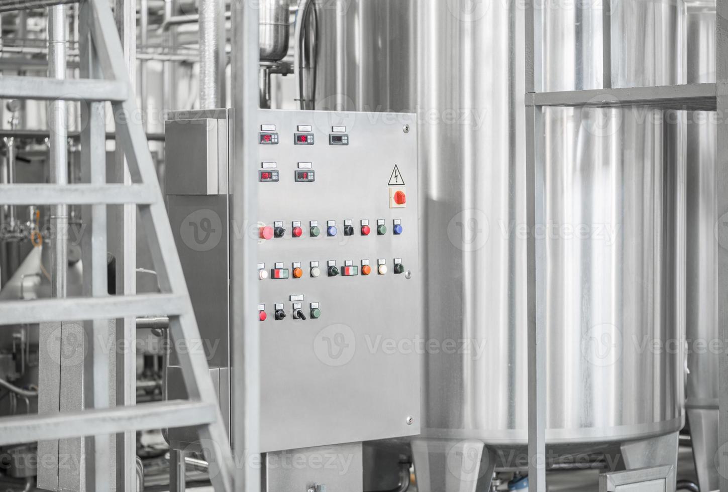 electronic control panel and tank at a milk factory. equipment at the dairy plant photo