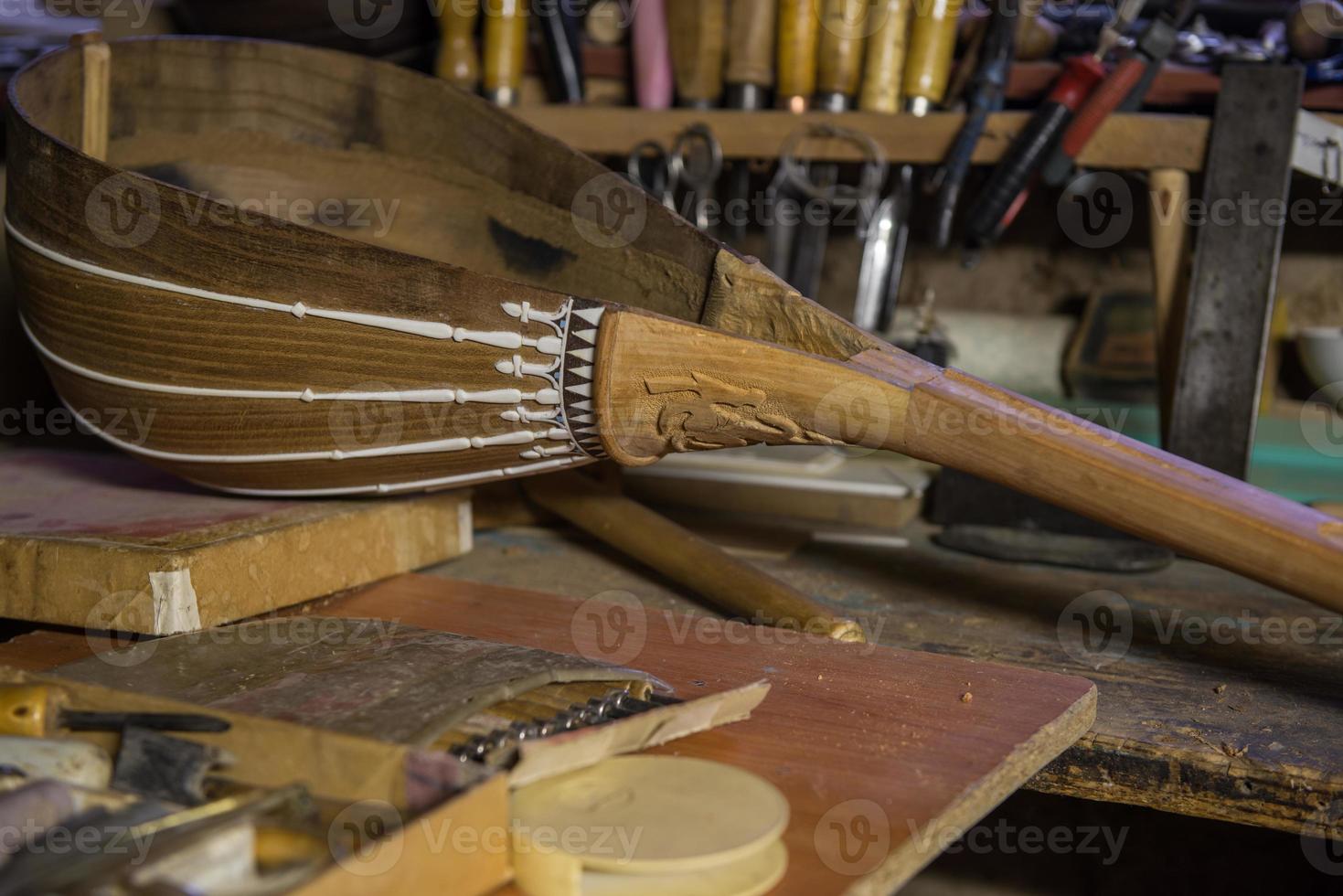 equipment in the workshop for the restoration of ancient musical instruments. wood carving tool photo