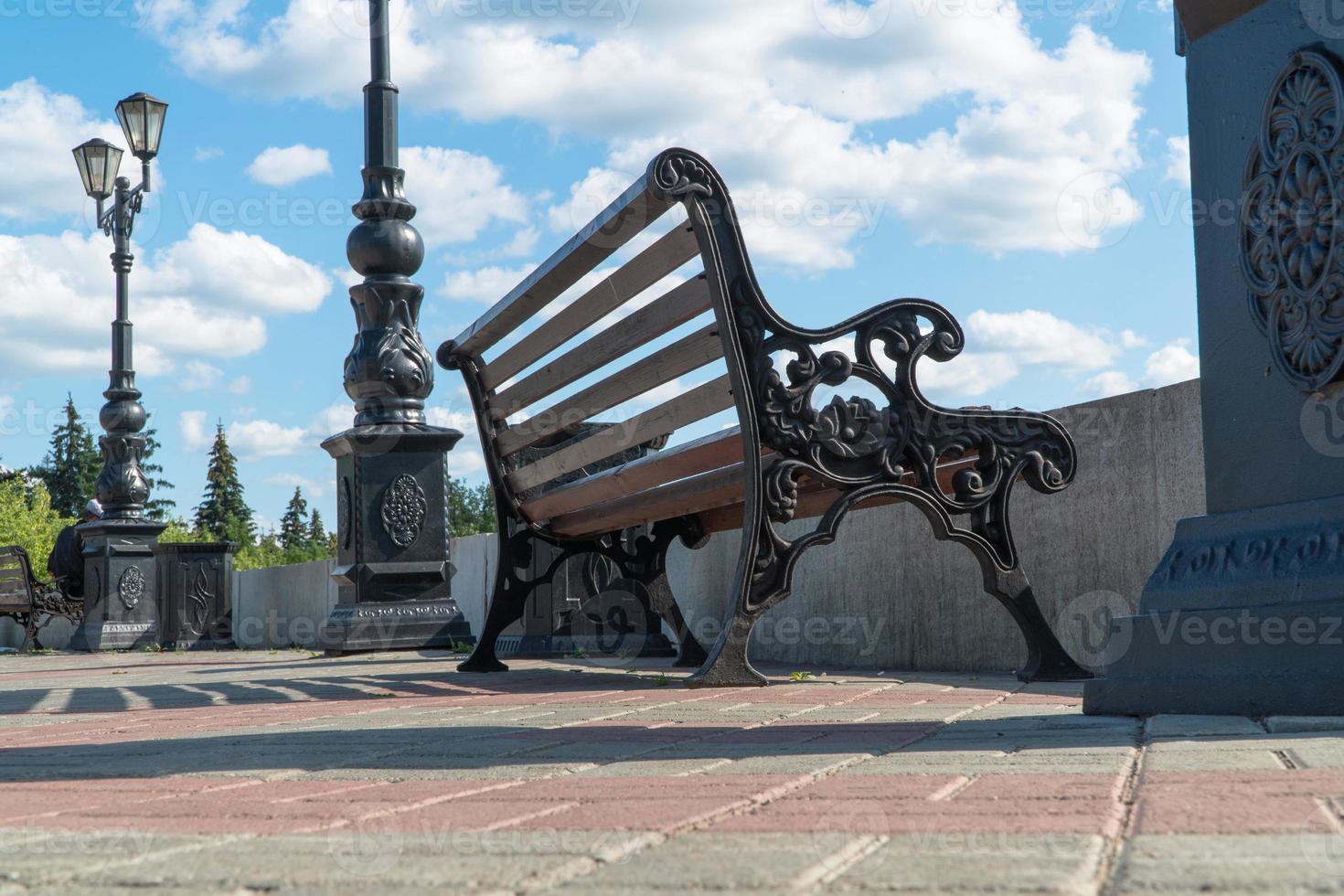 bench on the observation deck against the sky photo