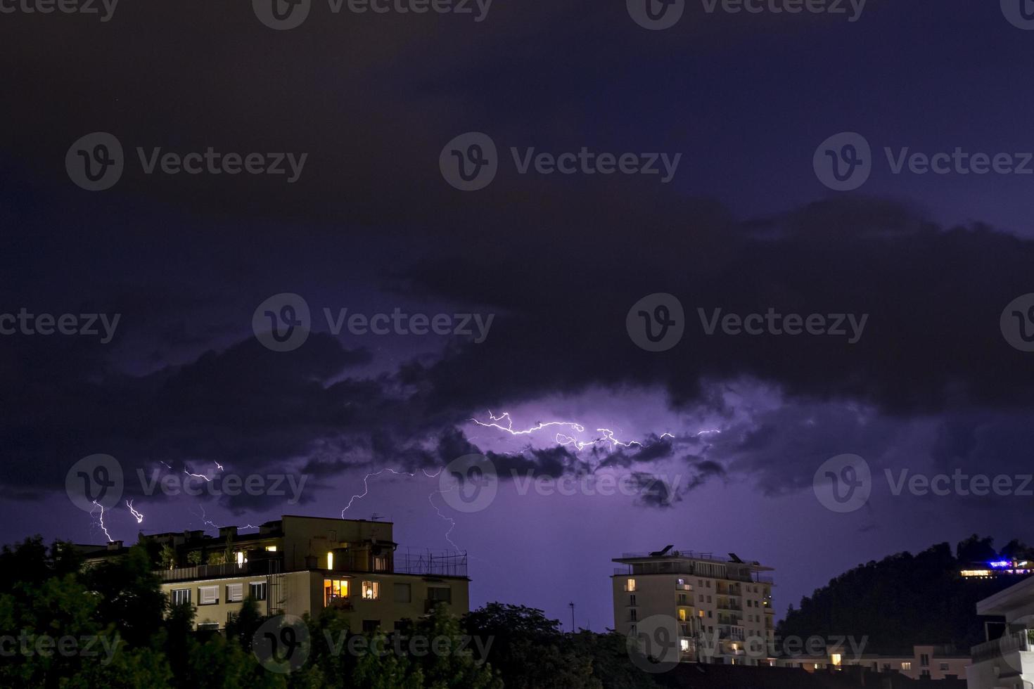 Lighning bolt over night sky in central Europe, Austria. photo