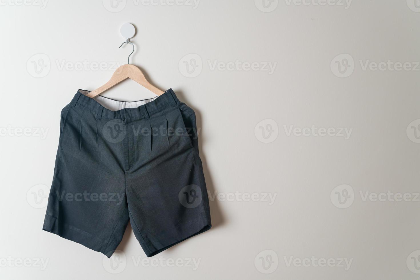 short pants hanging on wall photo