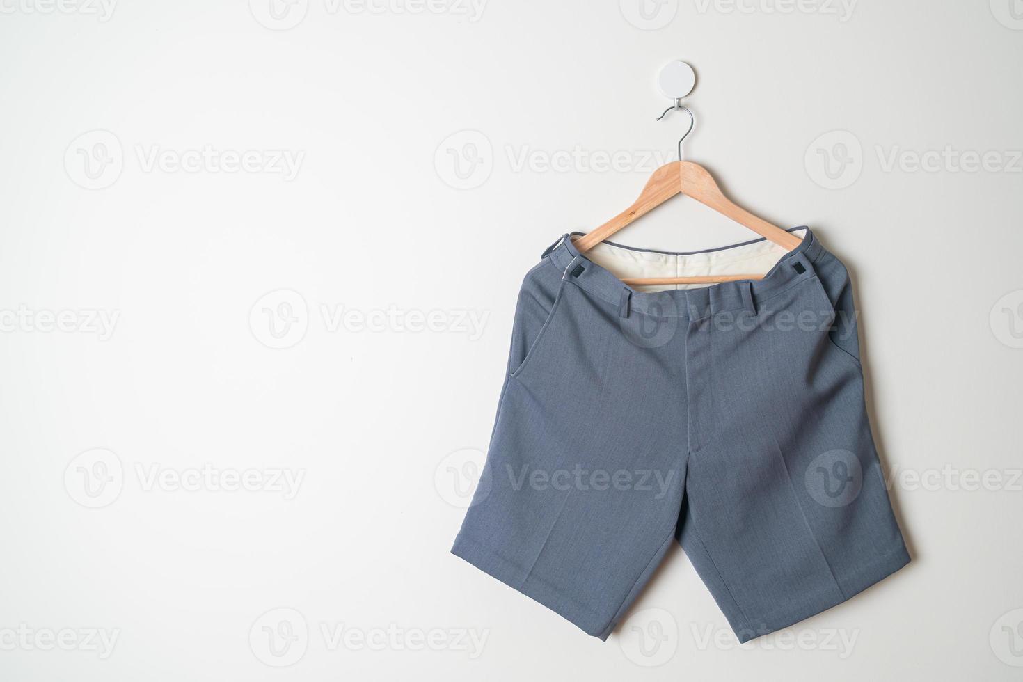 short pants hanging on wall photo