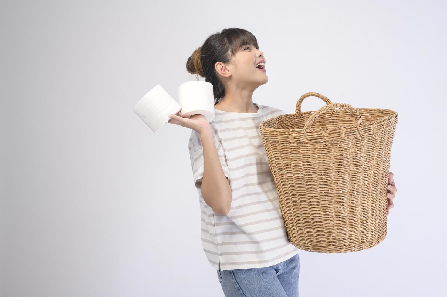 Young beautiful housewife smiling on white background photo