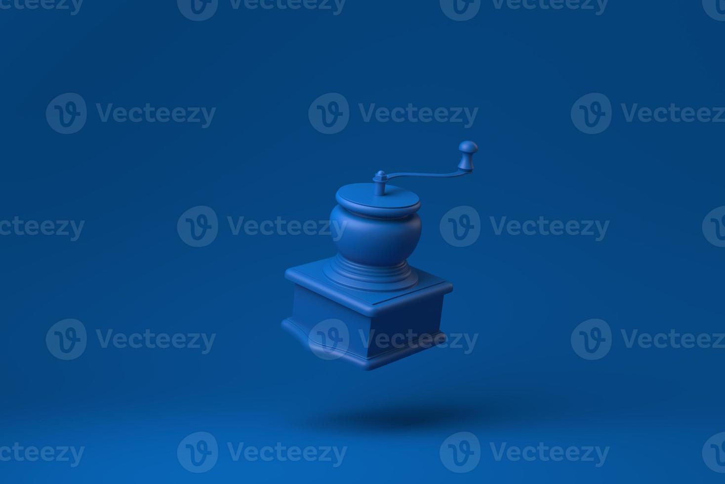 Blue Manual coffee grinder floating in blue background. minimal concept idea creative. monochrome. 3D render. photo