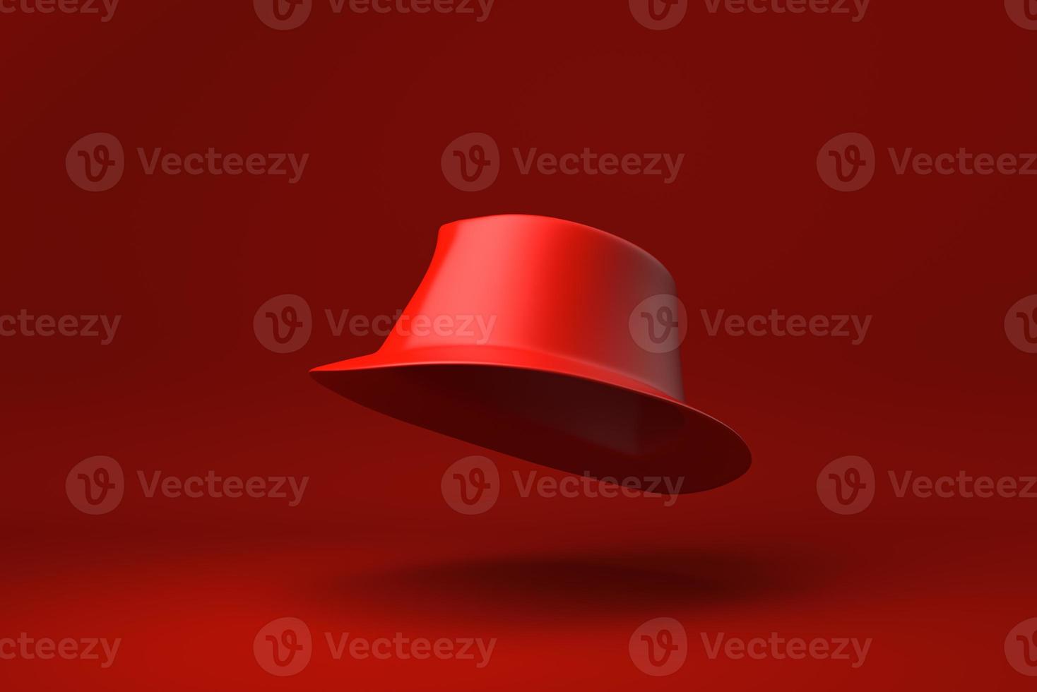 Red Fedora Hat floating in red background. minimal concept idea creative. monochrome. 3D render. photo