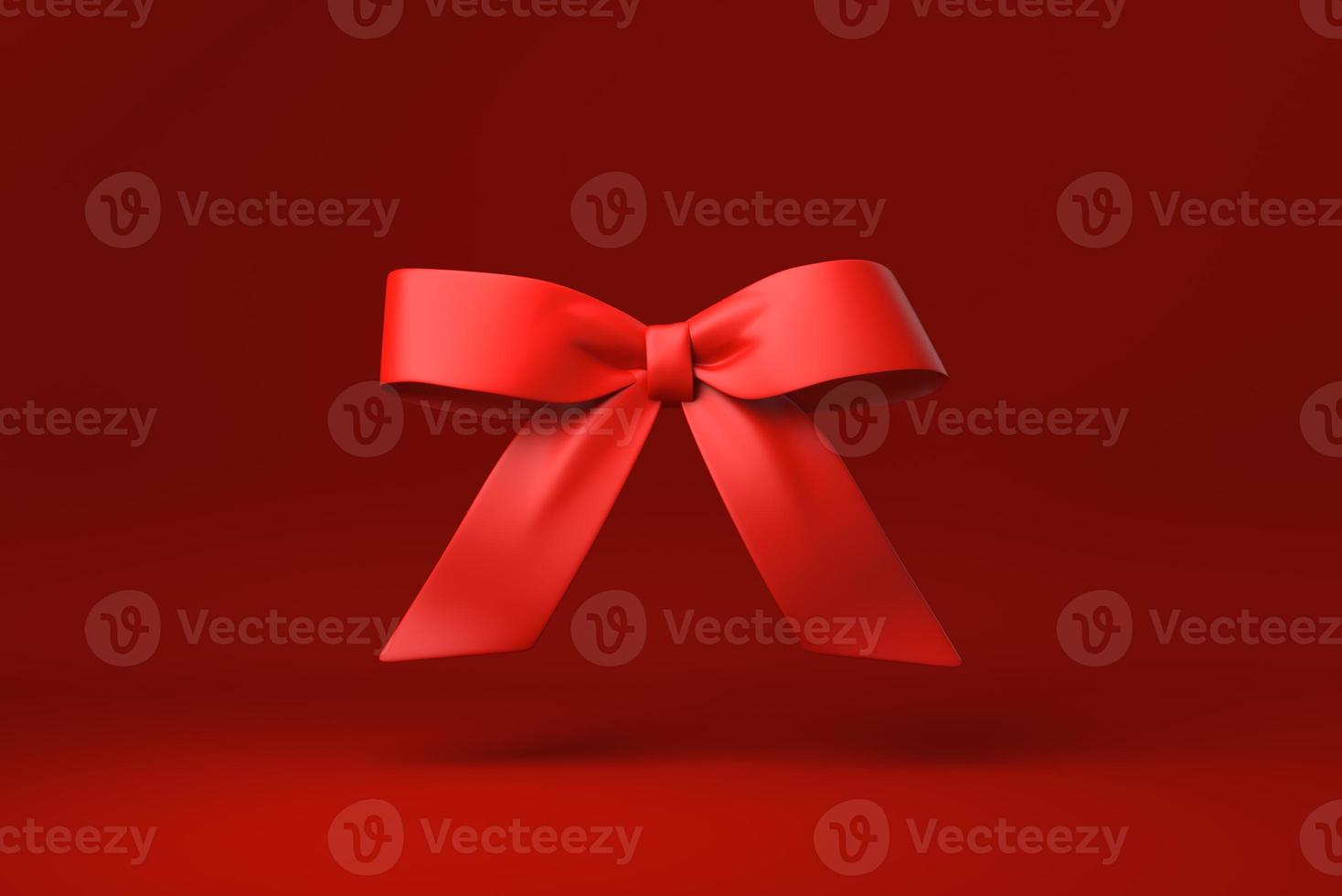 Red Bow in red background. minimal concept idea creative. monochrome. 3D render. photo