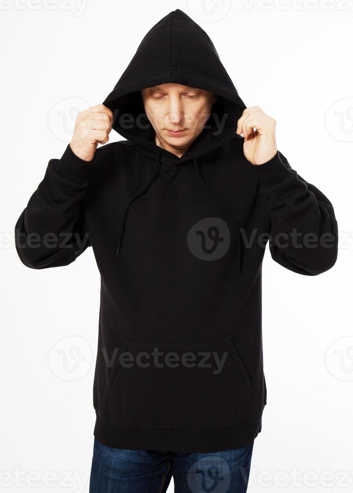 man in a black sweatshirt with a hood on his head is isolated on a white background photo