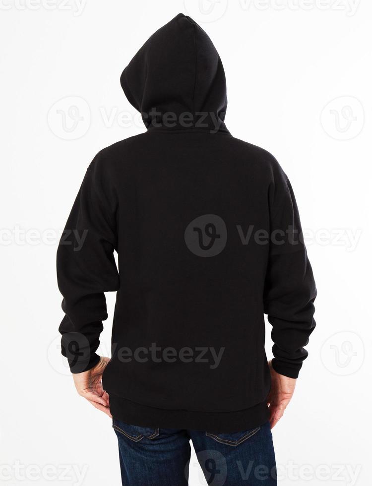 man in a black sweatshirt with a hood on his head is isolated on a white background - back view, top view photo