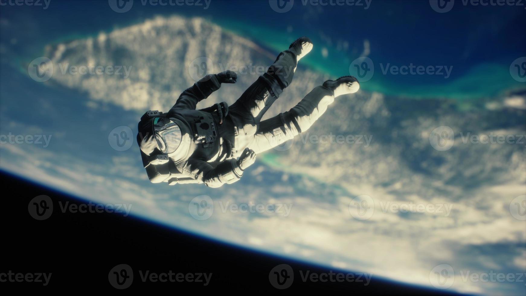 Astronaut floating above the Earth Elements of this image furnished by NASA photo