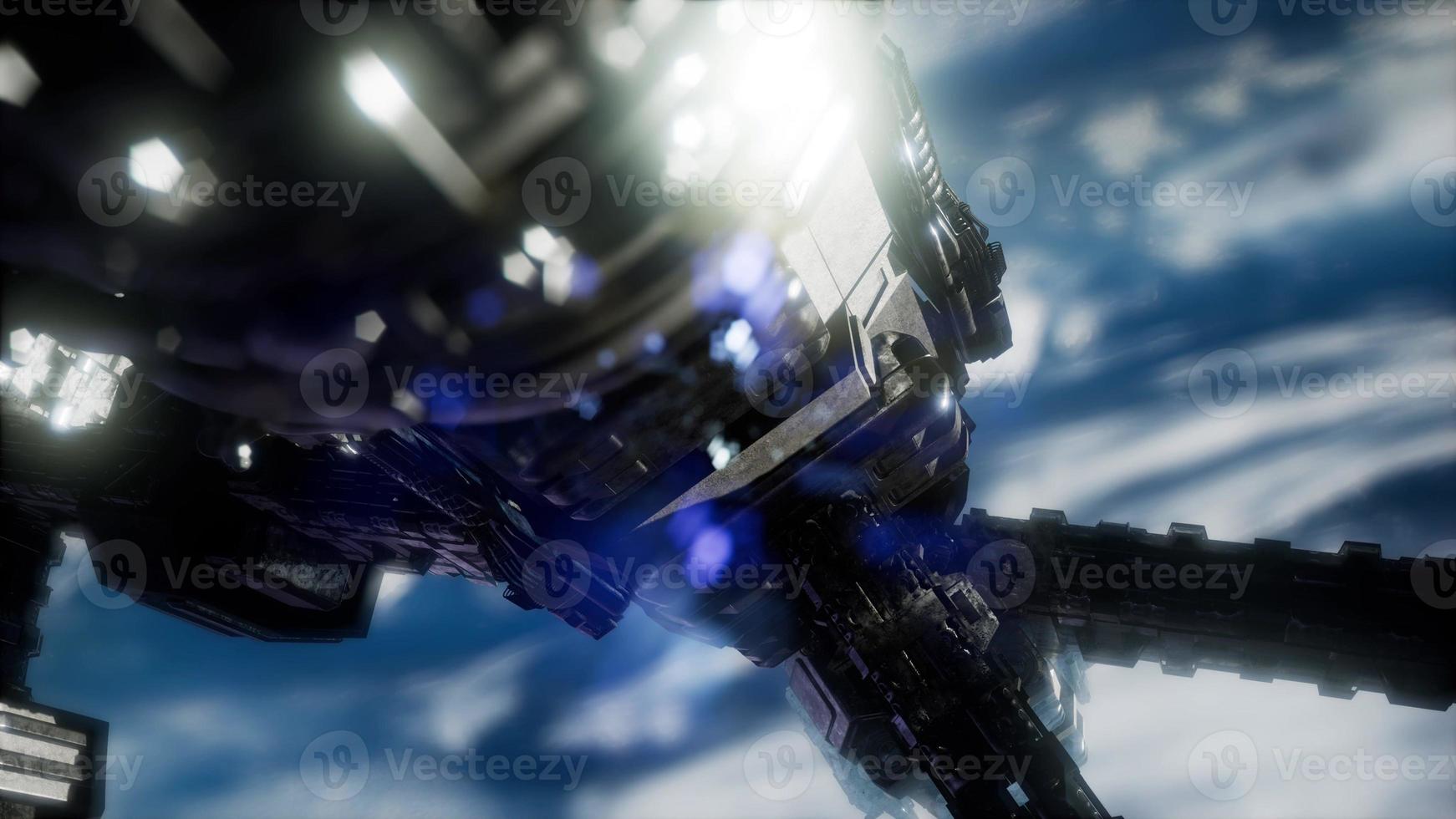 Highly detailed huge spaceship approaching to the Earth. photo