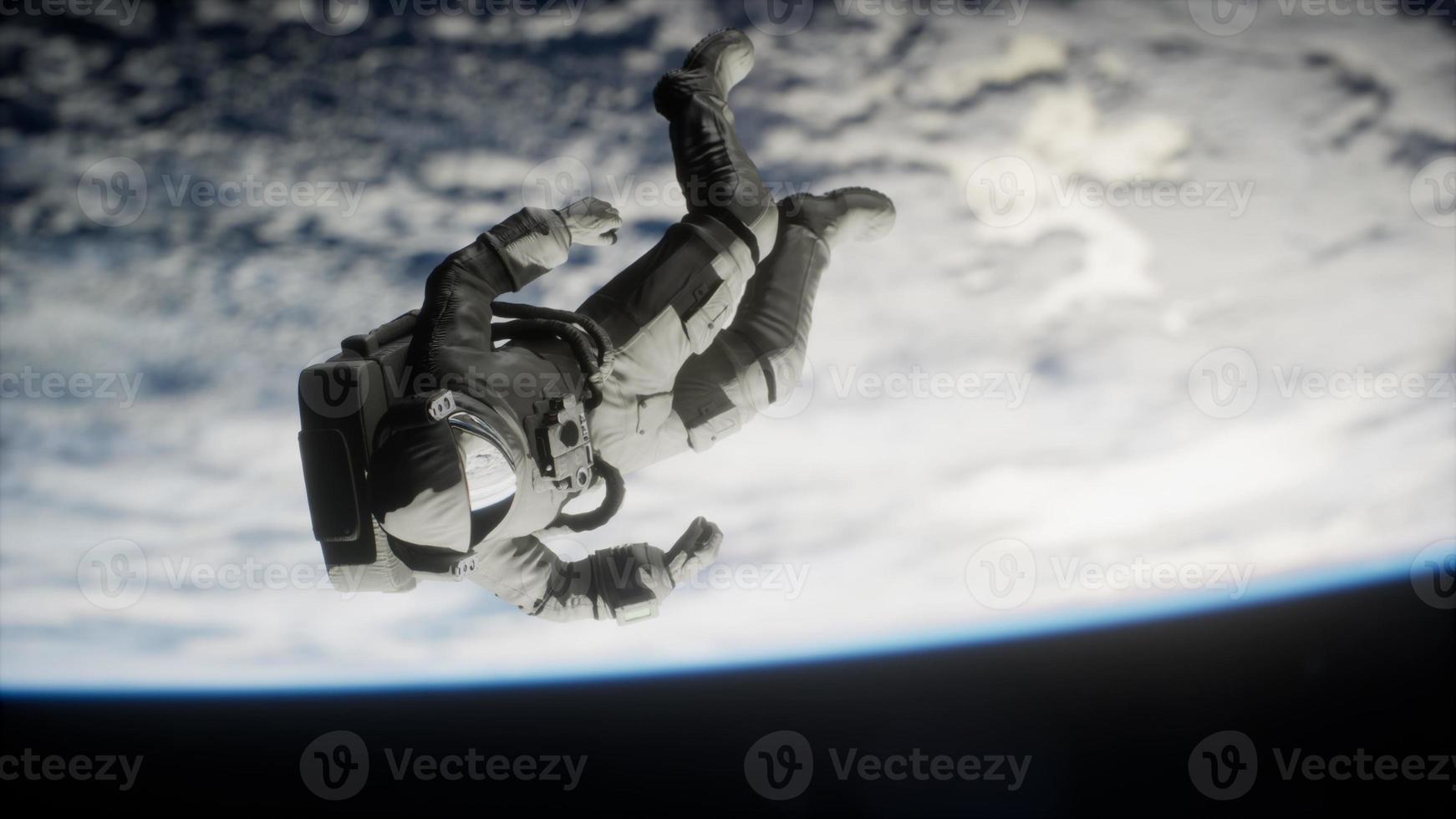 Astronaut floating above the Earth Elements of this image furnished by NASA photo