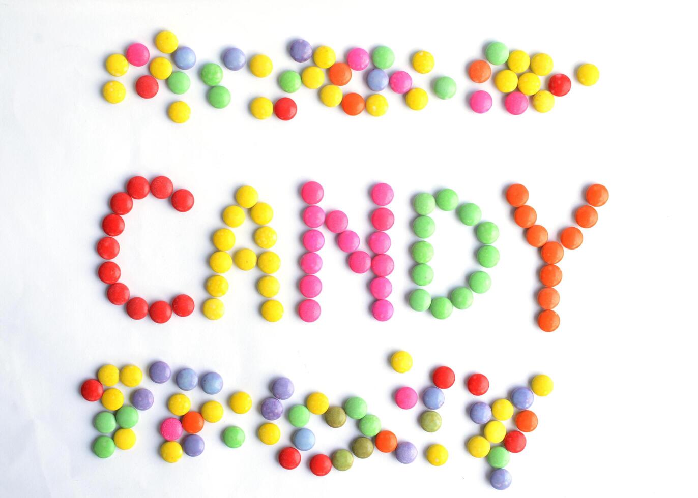 colorful chocolate coated candy backgrounds above photo