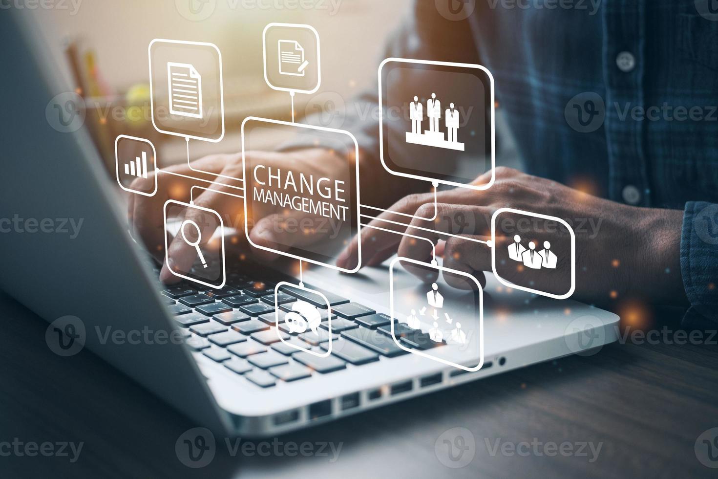 Businessman using a computer to document Change management in organization and business concept with consultant presenting icons of strategy. Organizational transition and transformation photo