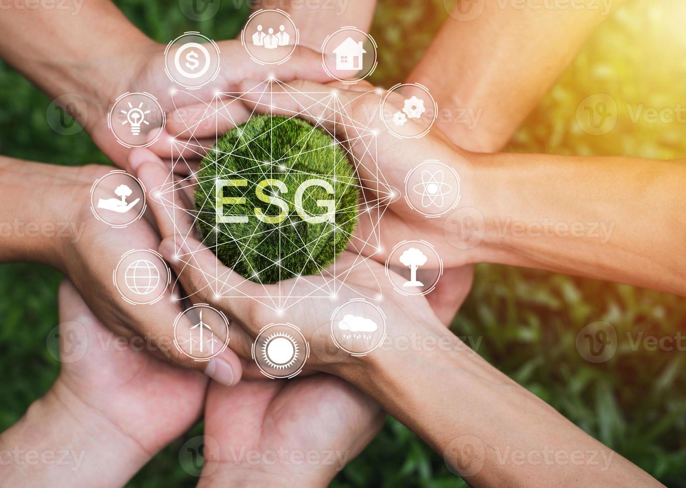 Hands adult Teamwork harmony Holding earth on hands with ESG icon concept for environmental, social, and governance in sustainable and ethical business on the Network connection photo