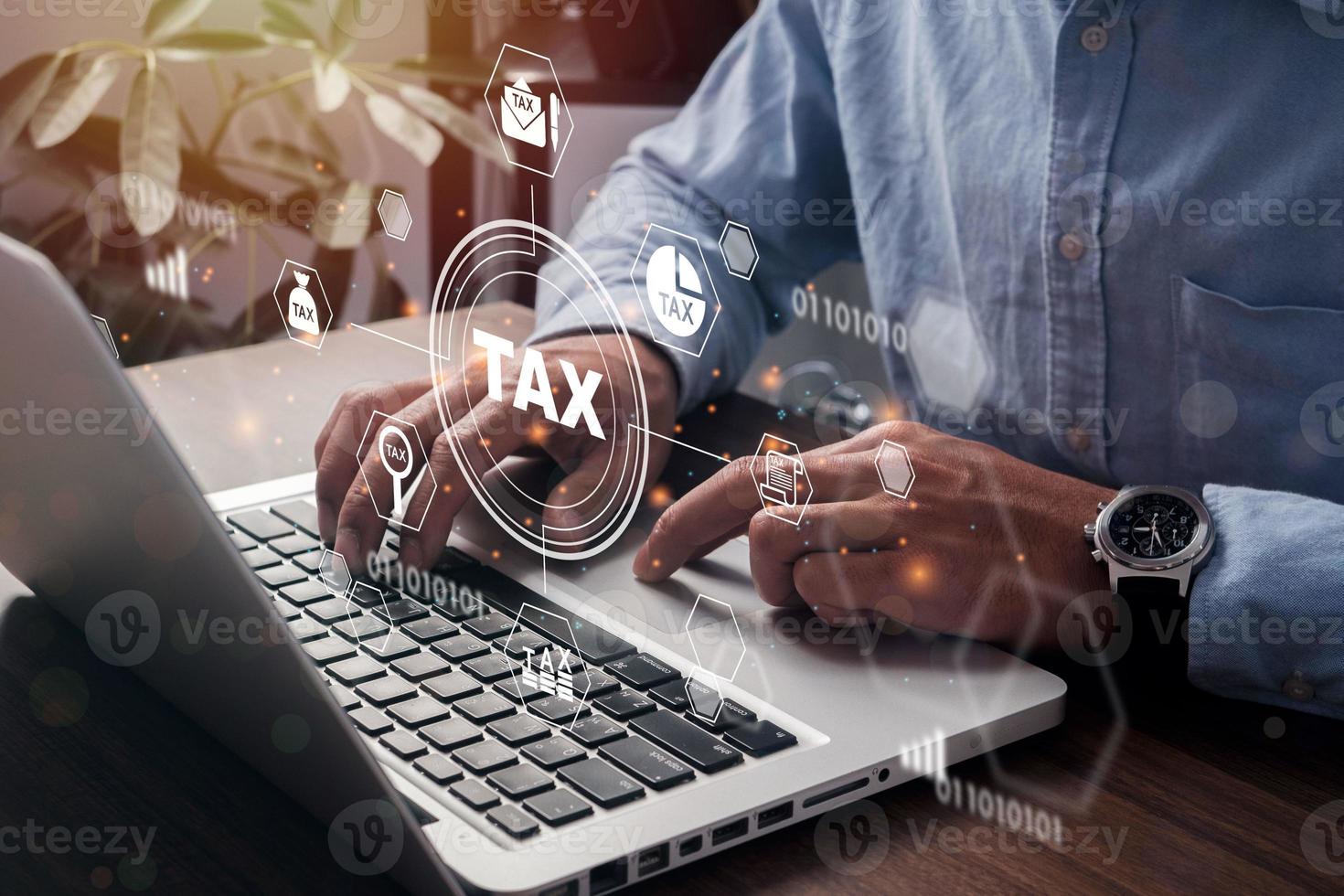 Businessman using a computer to Data analysis, paperwork, financial research, report. Calculation tax return. complete Individual income tax return form online for tax payment. Government. photo