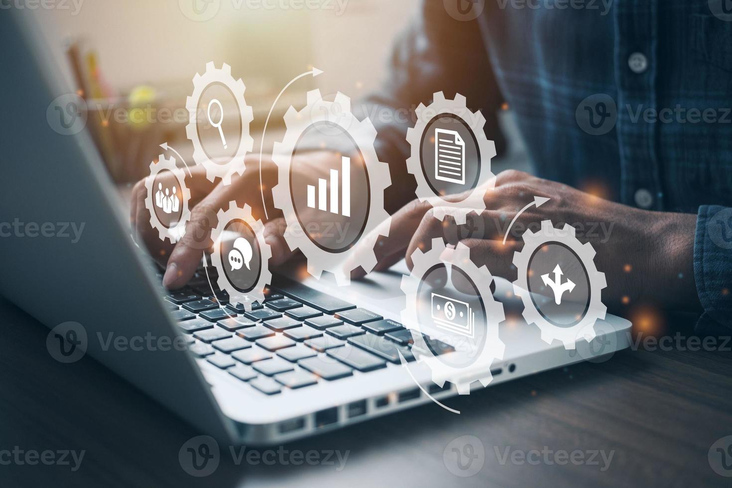 Person working on computer with icons of planning schedule of tasks and deliverables. Professional project manager presenting management skills concept. photo