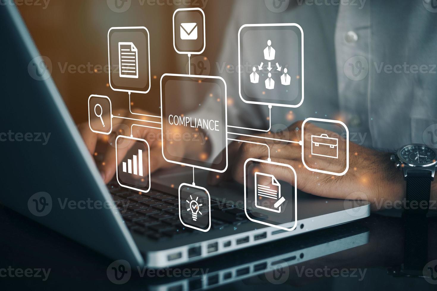 Businessman using a computer to document Compliance to Standards, Concept about conformity with manager or auditor pressing buttons with icons. photo