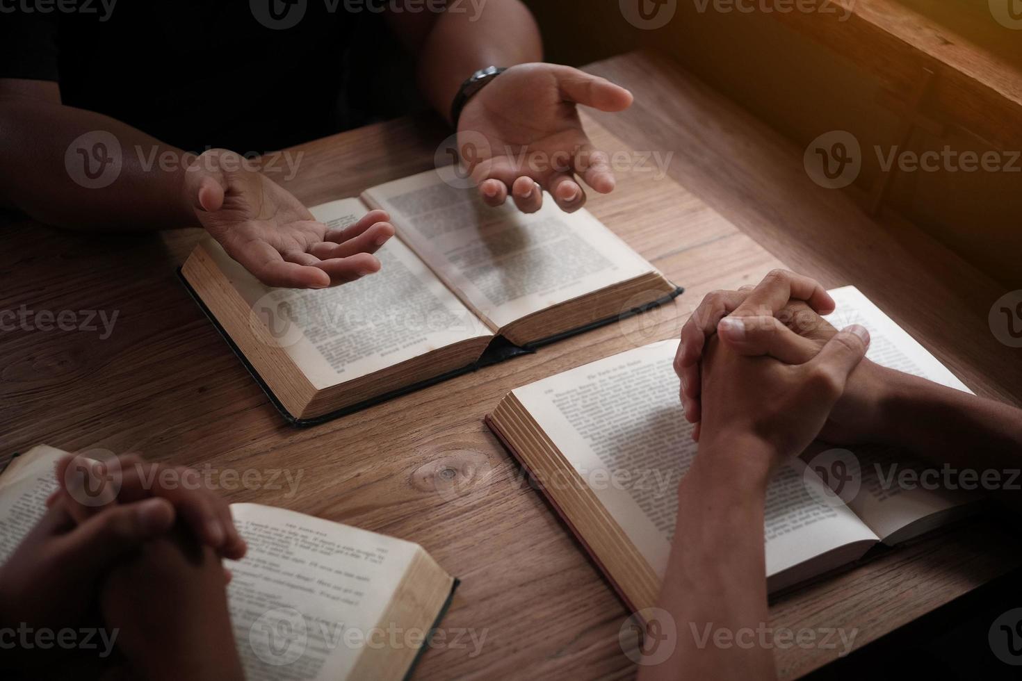Christians are congregants join hands to pray and seek the blessings of God. Devotional or prayer meeting concept. photo