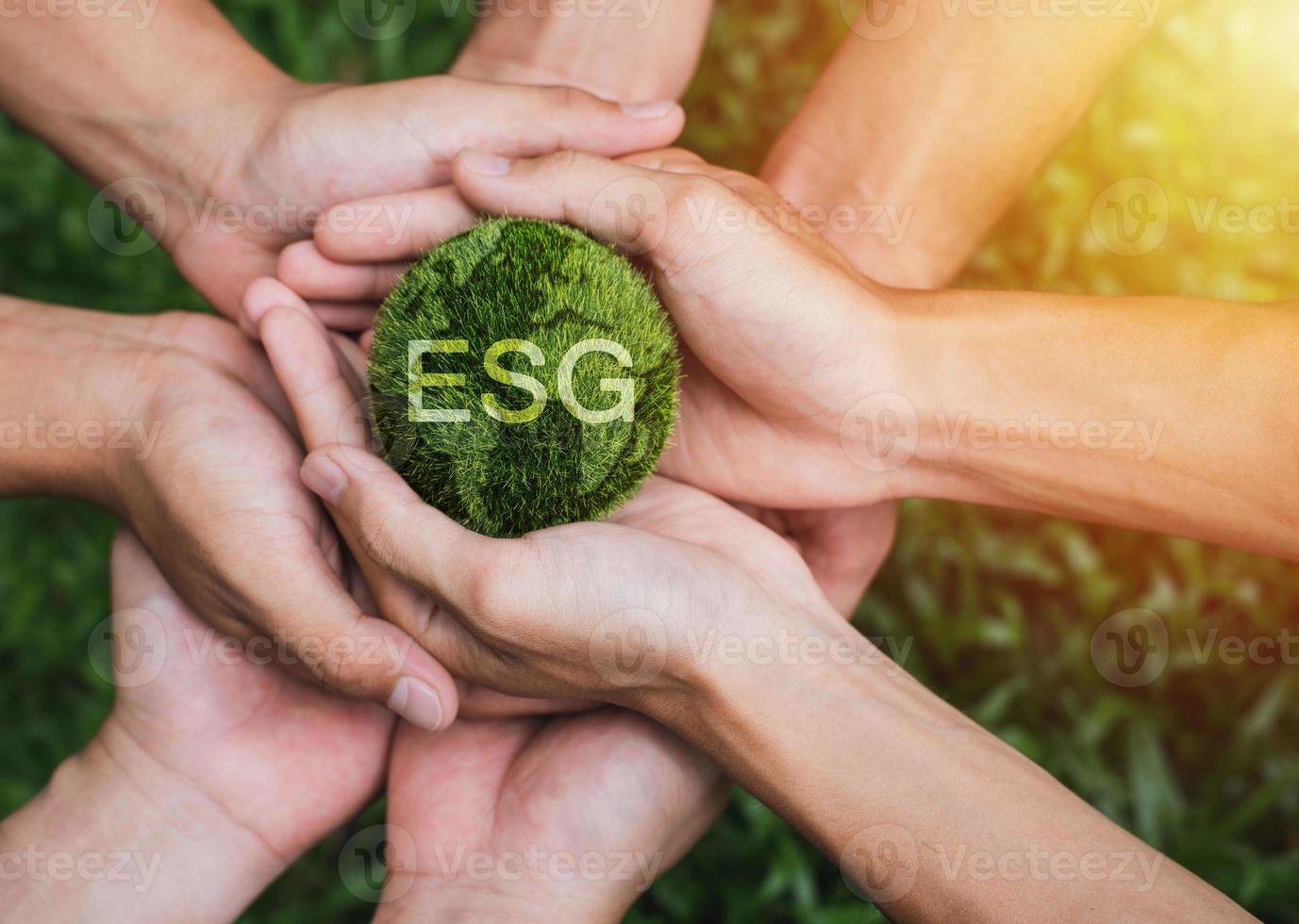 ESG Environmental. Hands adult Teamwork harmony Holding earth on hands. Nature, Ecology, Social Responsibility and Sustainability. photo