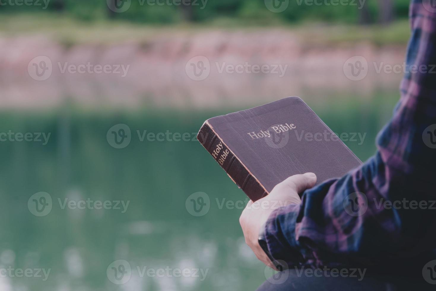 Man holding Holy bible ready for read and have relationship with god faith, spirituality and religion christian concept. photo