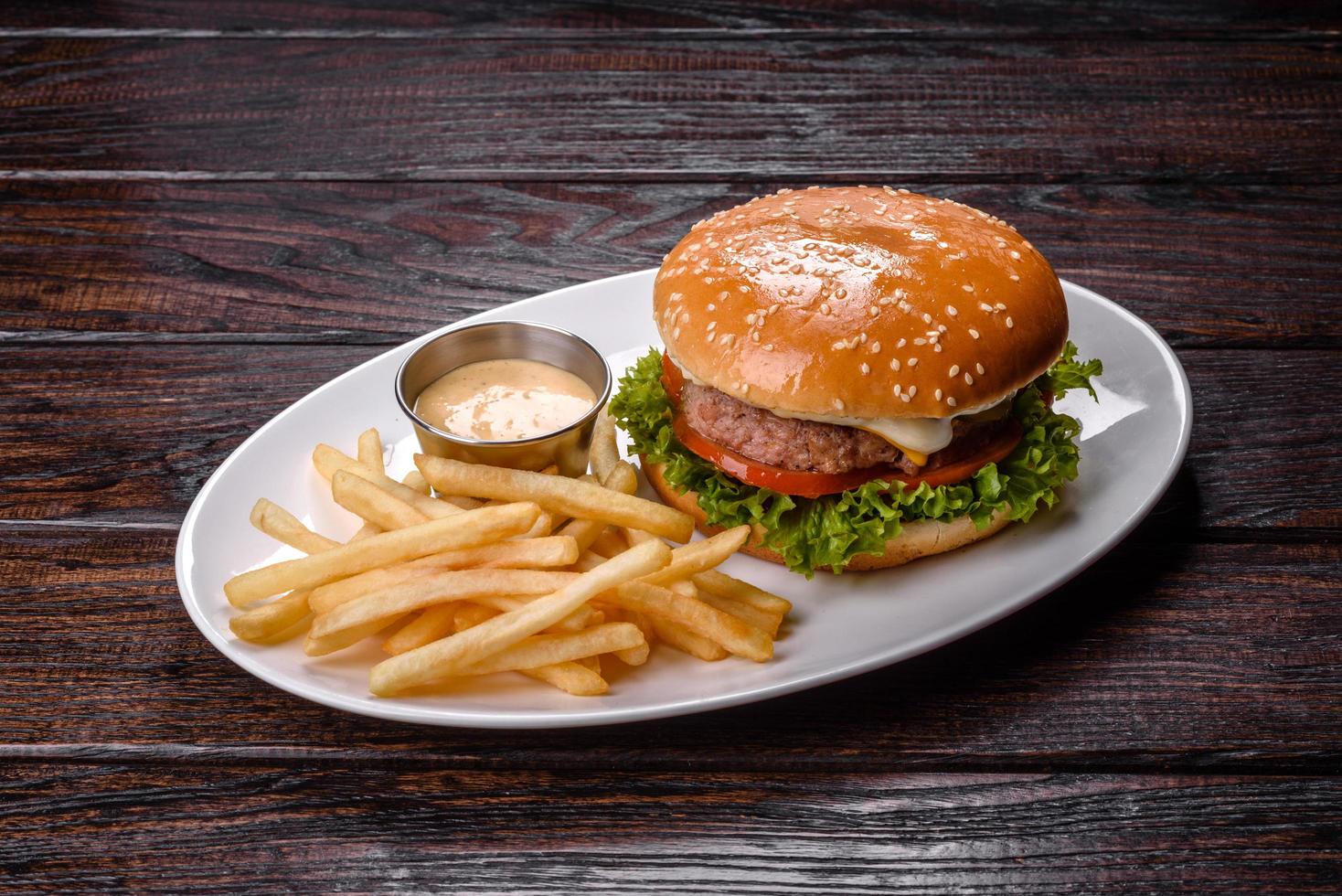 Close-up of home made tasty burger on a dark table photo