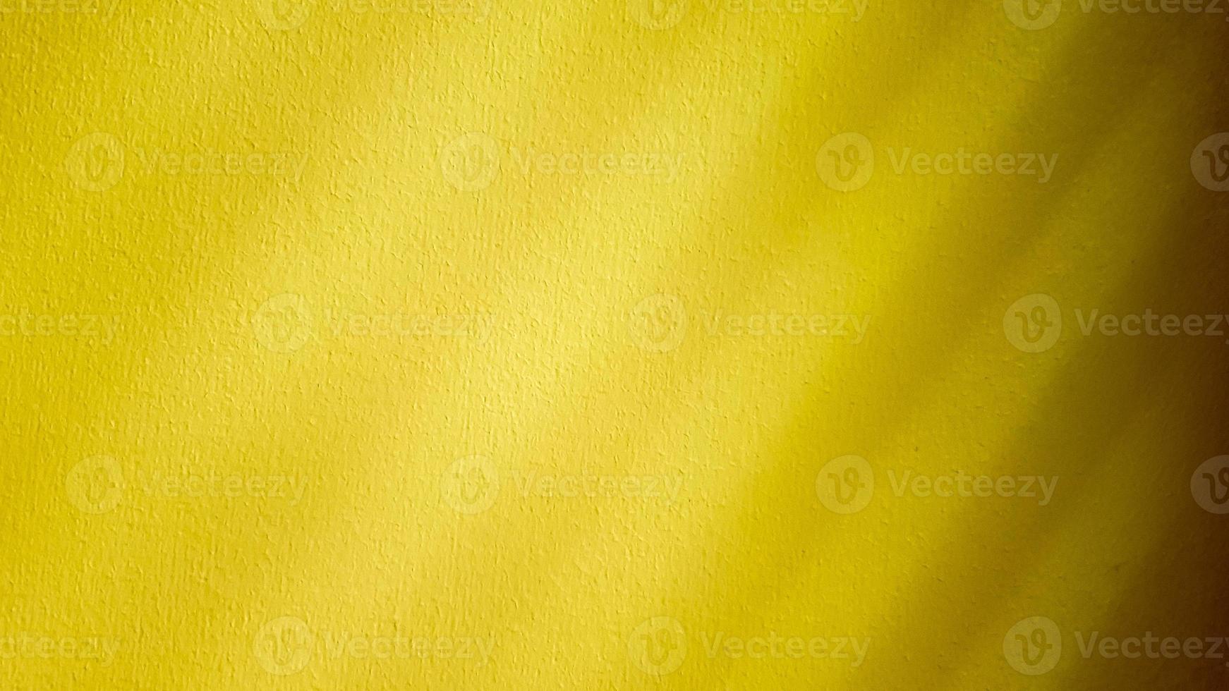 Yellow wall texture. Colorful concrete wall. Background and texture with Paint color on wall plaster. Close up texture old wall concrete photo