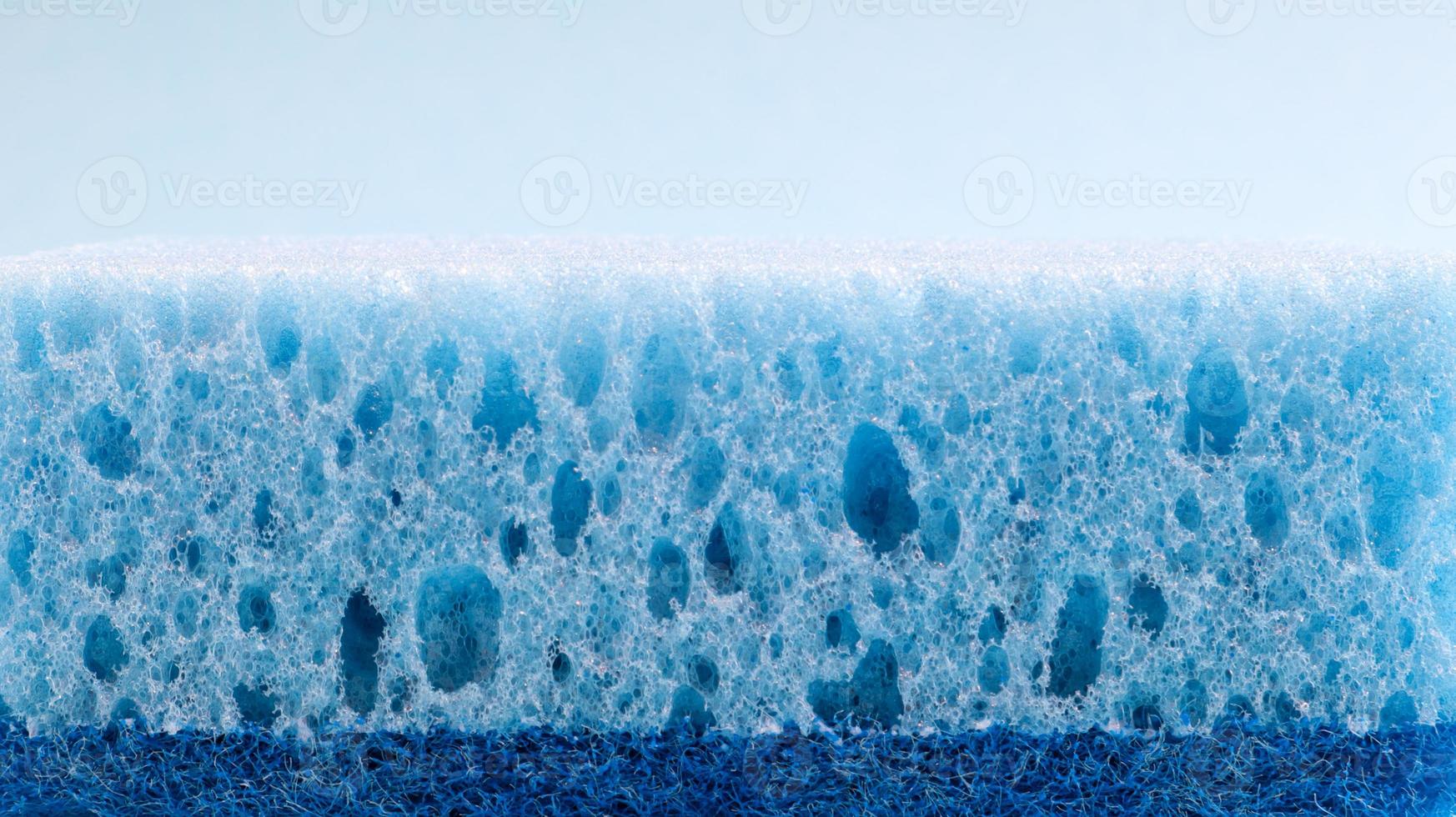 One blue sponge used to wash and erase dirt used by housewives in everyday life. They are made of porous material such as foam. Detergent retention, which allows you to spend it economically photo